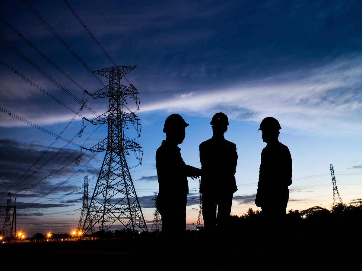 Three men in silhouette discussing